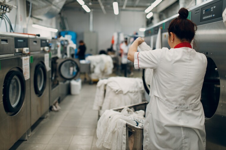 Dry cleaning clothes. Clean cloth chemical process. Laundry industrial dry-cleaning