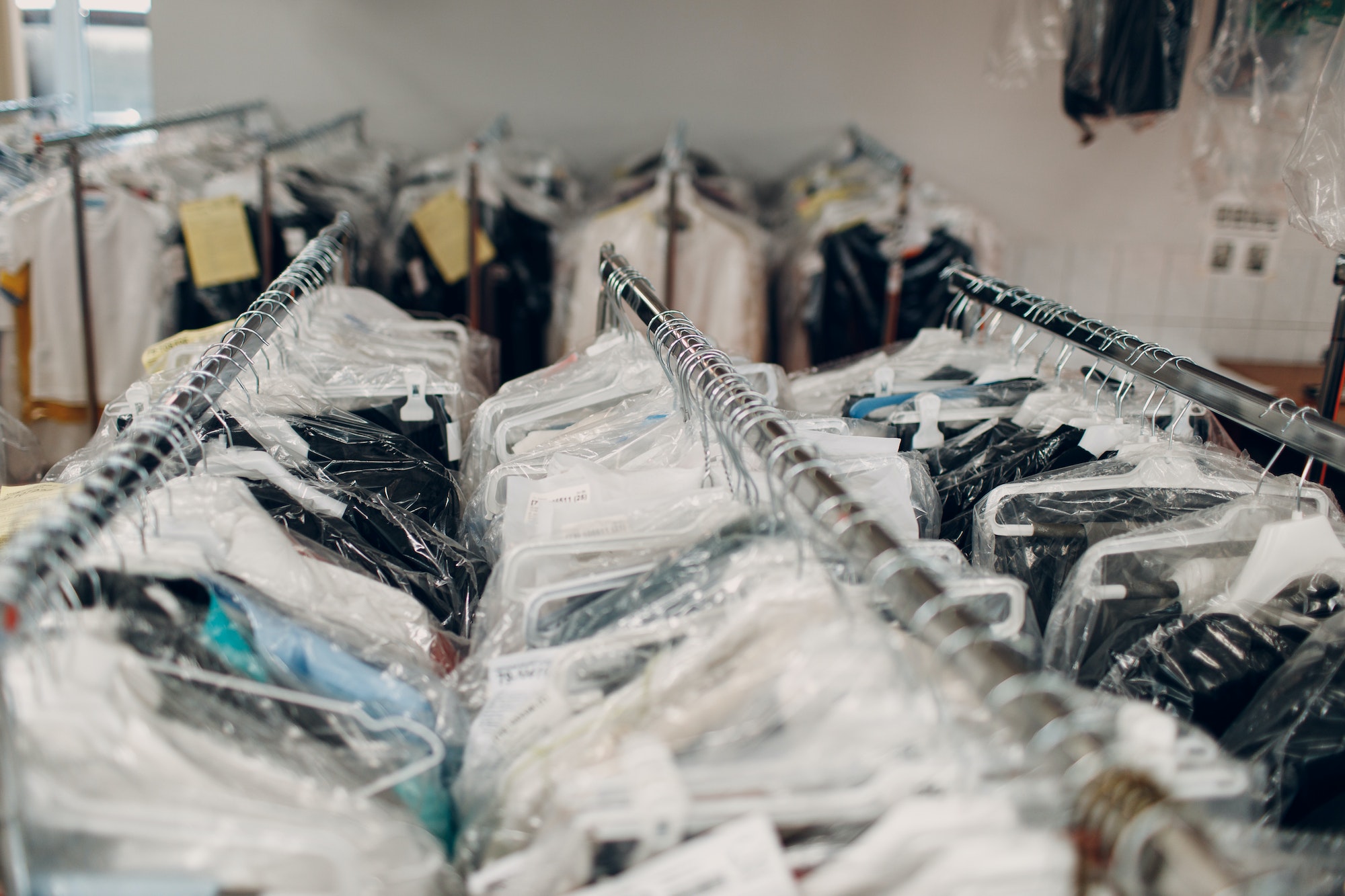 Dry cleaning clothes. Clean cloth chemical process. Laundry industrial dry-cleaning Dry cleaning clothes. Clean cloth chemical process. Laundry industrial dry-cleaning