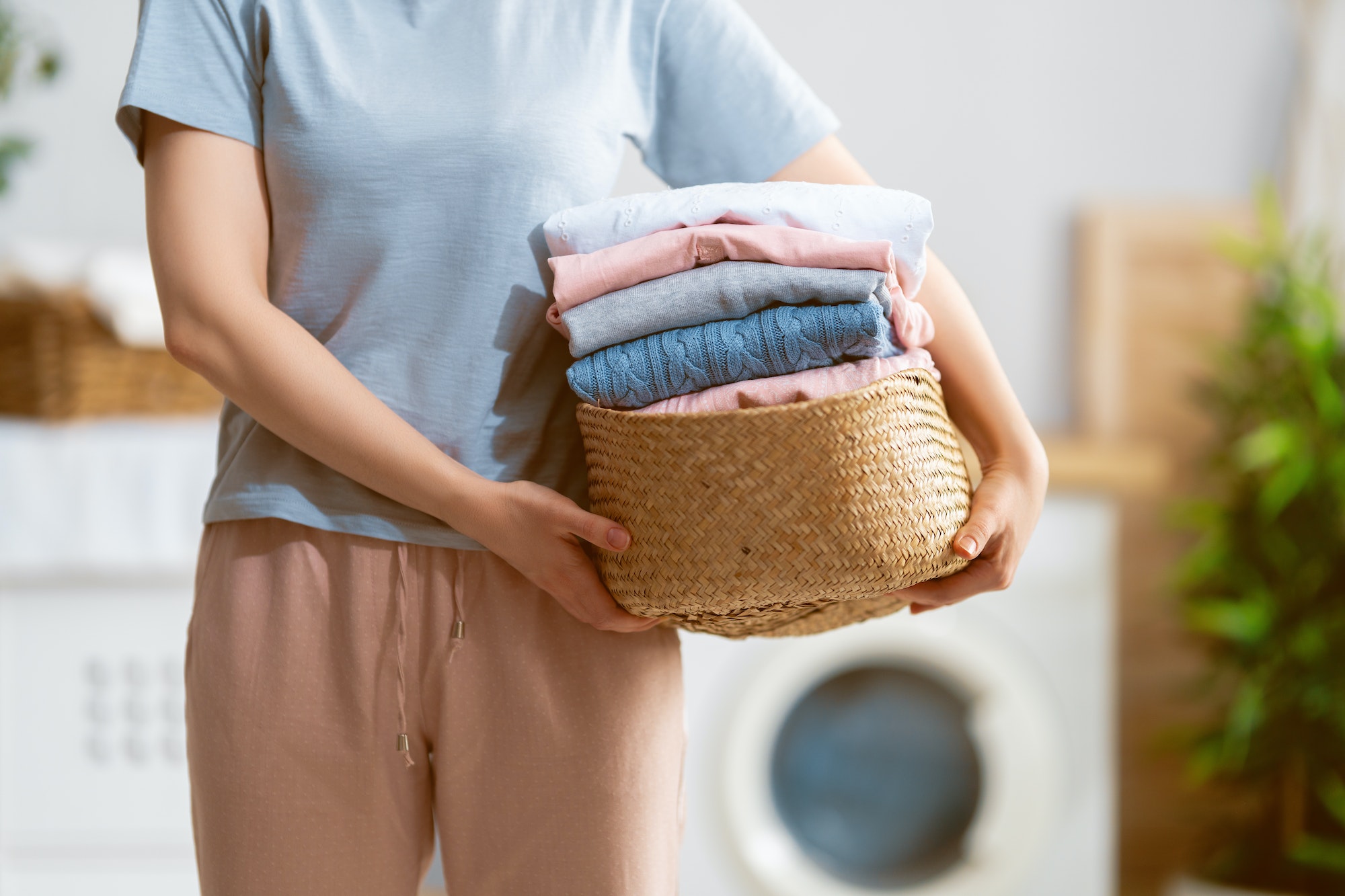 woman is doing laundry at home